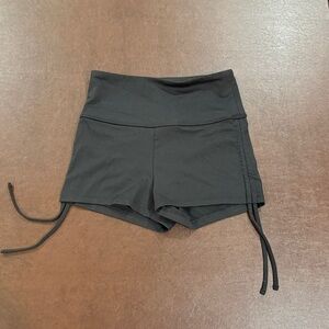 High-waisted black athletic booty shorts with adjustable ties size small